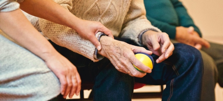 elderly couple holding hands symbolizing good living in Glendale for seniors