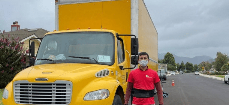 Bravo Mover in front of a yellow truck