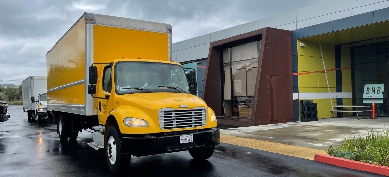 A yellow moving truck.