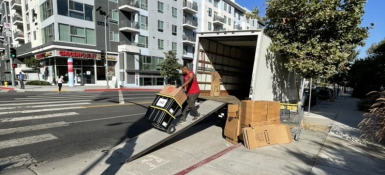 A mover loading items in a truck.