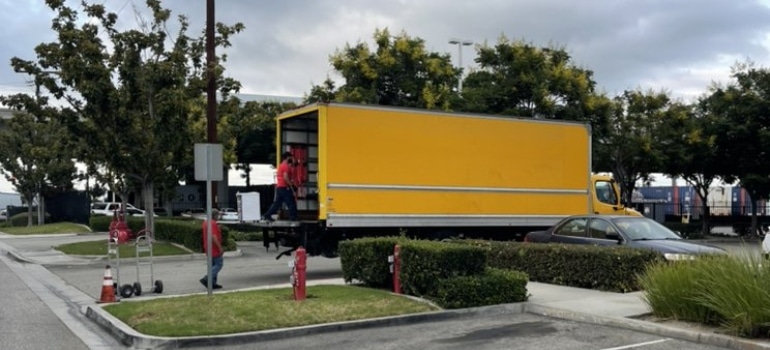 A yellow moving truck