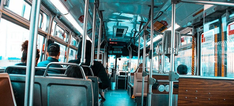 the inside of a bus with passengers