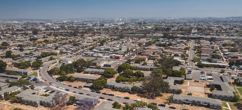 aerial view of lots of houses in LA and people living in Los Angeles county